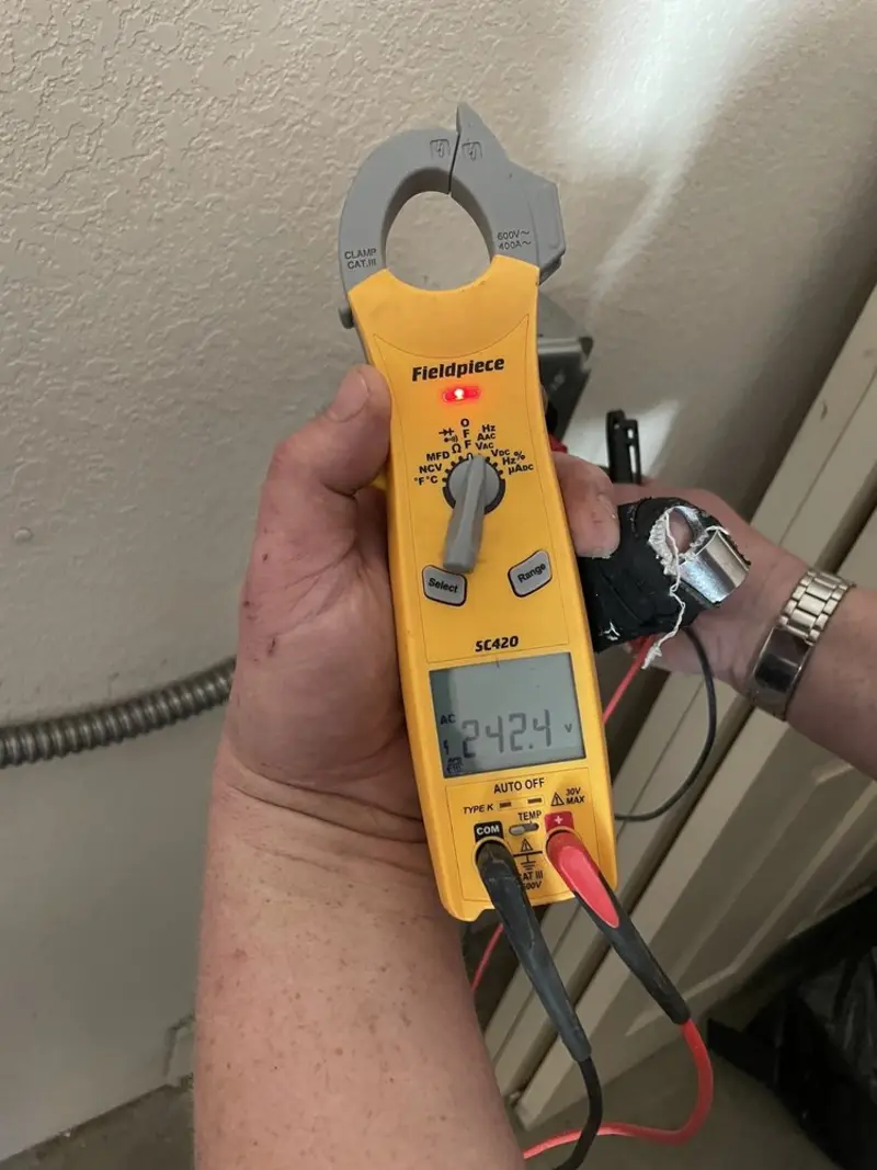 Voltage testing with clamp meter during Ceiling Fan Installation in Brighton